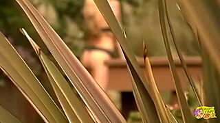 Blonde watches girl masturbate then strapon fucks outdoors