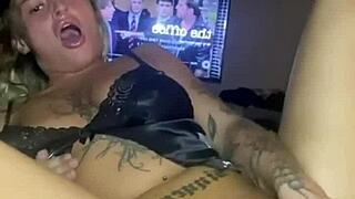 The teen goth whore spreads her legs and fucks her tight pussy