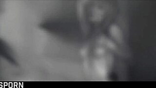 Two blonde girls enjoy sensual lesbian sex with a hot dildo, kissing passionately.