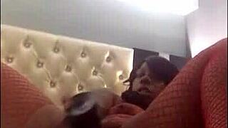 homemade ebony whore in fishnets masturbates and squirts her wet pussy. she moans loudly during the amateur session