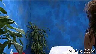 A cute masseuse demonstrates her body in a professional setting.