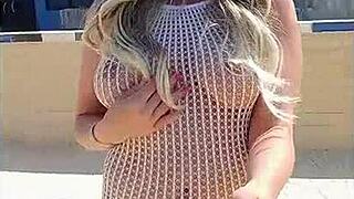 Transparent dress without underwear on a young blonde flashing her ass in public.