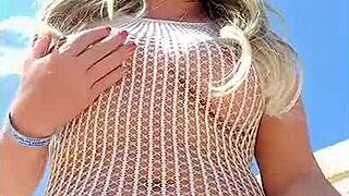 Transparent dress without underwear on a young blonde flashing her ass in public.