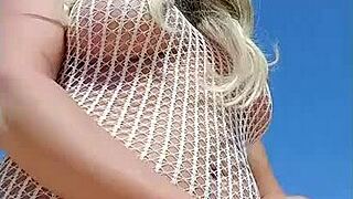 Transparent dress without underwear on a young blonde flashing her ass in public.