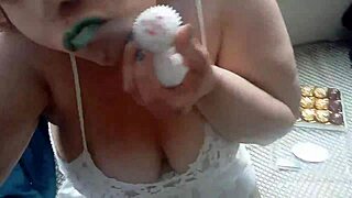 ginger paris masturbates sensually with chocolates in lingerie, feeling pleasure in her big tits and ass