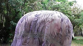 hairy mature woman flashes in her see-through dress outdoors