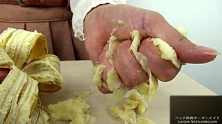 Asian girl dominates banana with hand crush fetish action. Pure intensity.