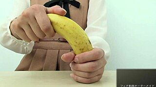 Asian girl dominates banana with hand crush fetish action. Pure intensity.