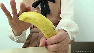 Asian girl dominates banana with hand crush fetish action. Pure intensity.