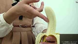 Asian girl dominates banana with hand crush fetish action. Pure intensity.