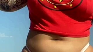 African Woman Gets Tattoo on Beach, Excites Guy Who Asks to See Her Big Pussy