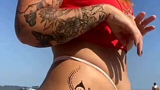 African Woman Gets Tattoo on Beach, Excites Guy Who Asks to See Her Big Pussy