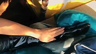 Woman Shows Off In Wetlook Suit And Boots!