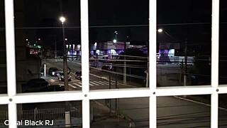 Couple fucking passionately at the apartment window.