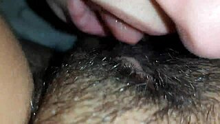 Lesbian couple eats hairy pussy in close-up video