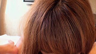 Watch this Asian girl take cum in her mouth at home!