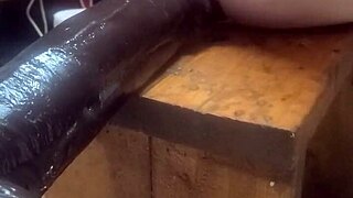 Feeling the huge dildos on the fucking machine for intense anal pleasure.