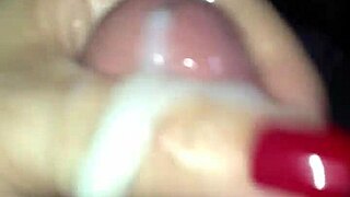 red nail hand stroking cock until cum shoots out.