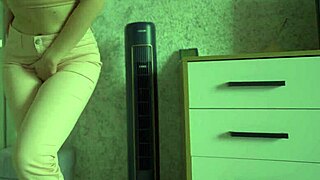 Female Desperately Pees In Jeans At Home