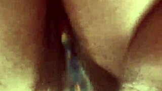 Curvy woman masturbates hairy pussy with glass dildo close up