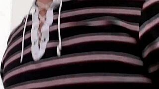 slutty milf watches as her boyfriend gives a blowjob to his friend, enjoying the show.