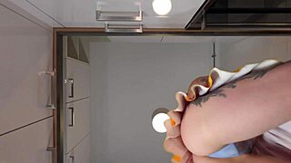 Redhead cheerleader shows see-through panties in kitchen