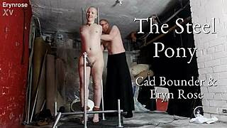 Bound in steel pony device for intense bondage session with toys.