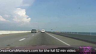 Brunette dream girl flashes big boobs topless in public convertible over skyway bridge