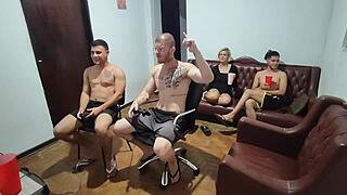 Friends playing video games turn to bareback anal sex.