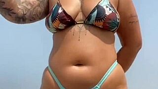 Young African Babe Meets Muscular Guy On Beach, Applies Sunscreen Boldly