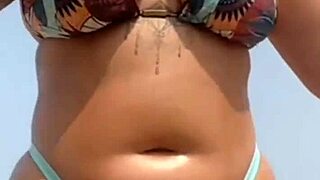 Young African Babe Meets Muscular Guy On Beach, Applies Sunscreen Boldly