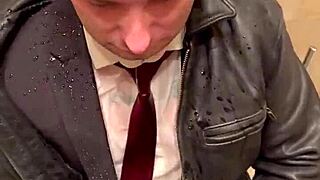 Men in leather costumes play kinky at office