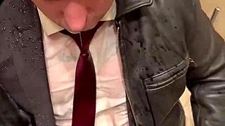 Men in leather costumes play kinky at office