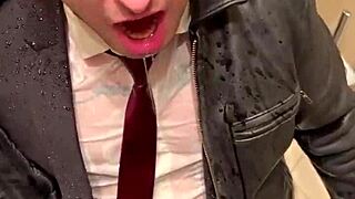 Men in leather costumes play kinky at office