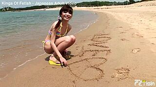 Skinny Japanese Chick Poses In Bikini For Beach Photoshoot Close-Up