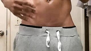 After shower oil rub down on big black cock in solo masturbation.