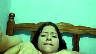 I'm in the bedroom, touching myself with my natural tits until I cum hard.