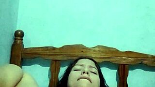 I'm in the bedroom, touching myself with my natural tits until I cum hard.