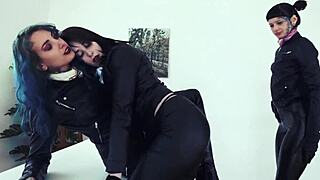 Leather-clad women engage in group activities at the office