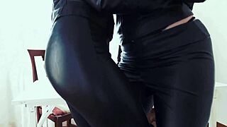 Leather-clad women engage in group activities at the office