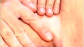 Mature woman fingers her hot shaved pussy up close, natural tits heaving during homemade masturbation