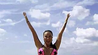 Monika Fox Poses in Pink Bikini on Beach