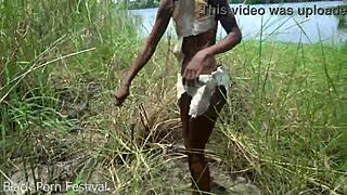 skinny african woman works outdoors in tribe