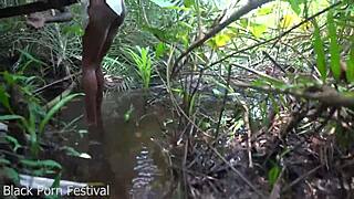 skinny african woman works outdoors in tribe