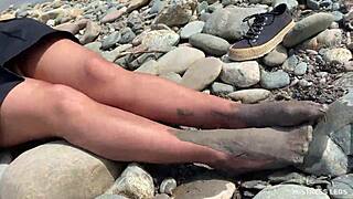 goddess shows you her messy nylon feet close ups in torn pantyhose on the river bank