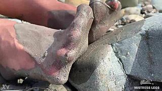 goddess shows you her messy nylon feet close ups in torn pantyhose on the river bank