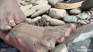 goddess shows you her messy nylon feet close ups in torn pantyhose on the river bank