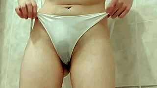 i really want to pee, so i undress and piss in the bath through my wet panties, then squeeze them into your mouth