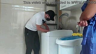 Housewife provoking the technician fixing the washing machine