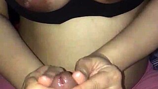 Watch this wife with big tits giving an amazing handjob